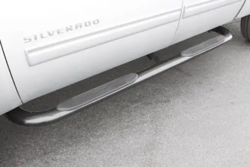 Lund 99-13 Chevy Silverado 1500 Ext. Cab (Body Mount) 4in. Oval Curved SS Nerf Bars - Polished
