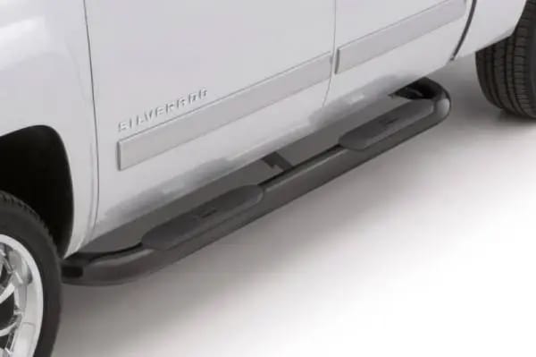 Lund 01-13 Chevy Silverado 1500 Crew Cab (Body Mount) 4in. Oval Curved Steel Nerf Bars - Black thumbnail 4